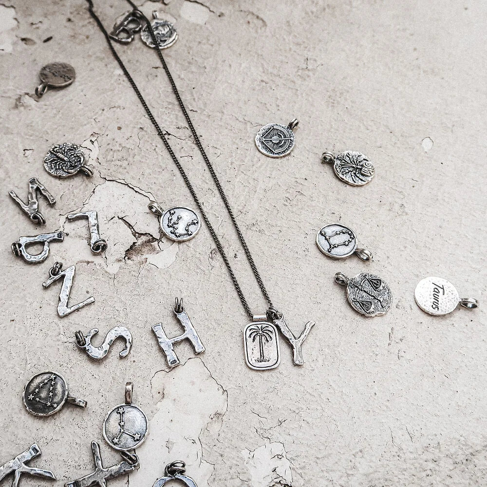 Persönlicher Schmuck mit Astro Symbolen